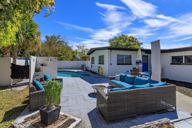 exterior space featuring a fenced in pool, a fenced backyard, and outdoor lounge area