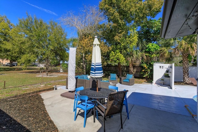 view of patio / terrace featuring outdoor dining area and a fenced backyard