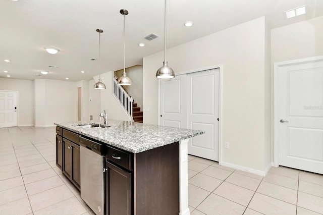 kitchen with visible vents, a sink, stainless steel dishwasher, and light tile patterned floors