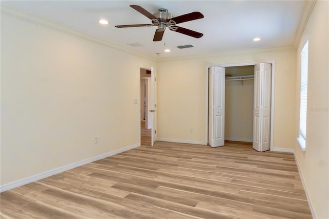 unfurnished bedroom featuring baseboards, visible vents, light wood-style flooring, recessed lighting, and crown molding