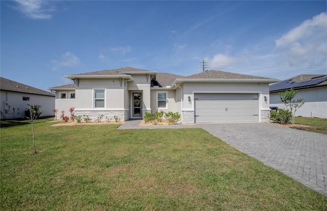 2720 Bancroft Blvd, Orlando, FL 32833 - prairie-style home featuring stone siding, decorative driveway, an attached garage, a front yard, and stucco siding