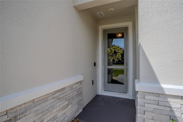 2720 Bancroft Blvd, Orlando, FL 32833 - entrance to property featuring stucco siding and visible vents