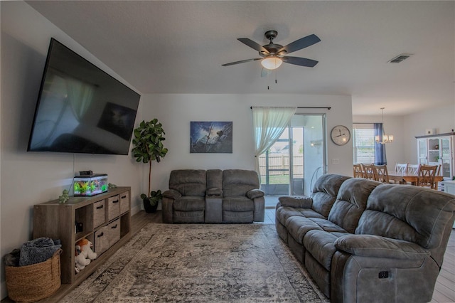2720 Bancroft Blvd, Orlando, FL 32833 - living room with visible vents, ceiling fan with notable chandelier, and wood finished floors