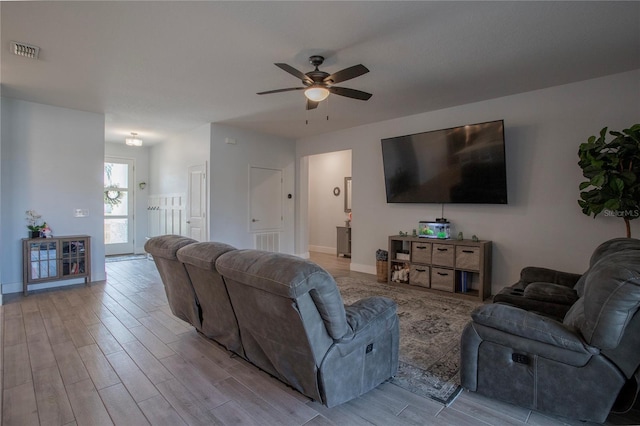 2720 Bancroft Blvd, Orlando, FL 32833 - living area with baseboards, visible vents, wood finished floors, and a ceiling fan