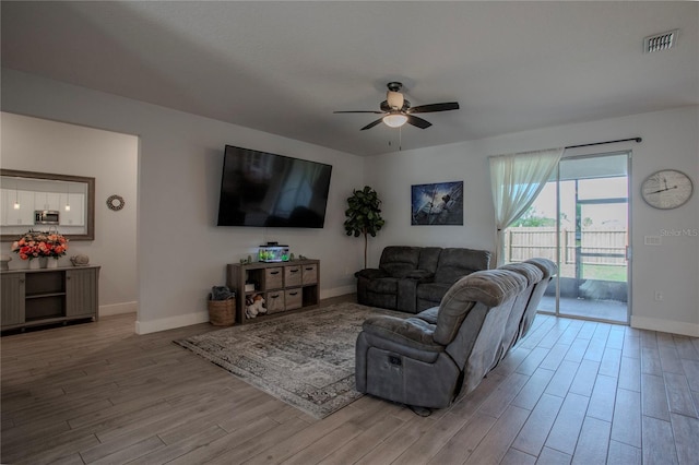 2720 Bancroft Blvd, Orlando, FL 32833 - living room featuring light wood-type flooring, baseboards, ceiling fan, and visible vents
