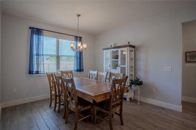 2720 Bancroft Blvd, Orlando, FL 32833 - dining space featuring a notable chandelier, baseboards, and wood finished floors
