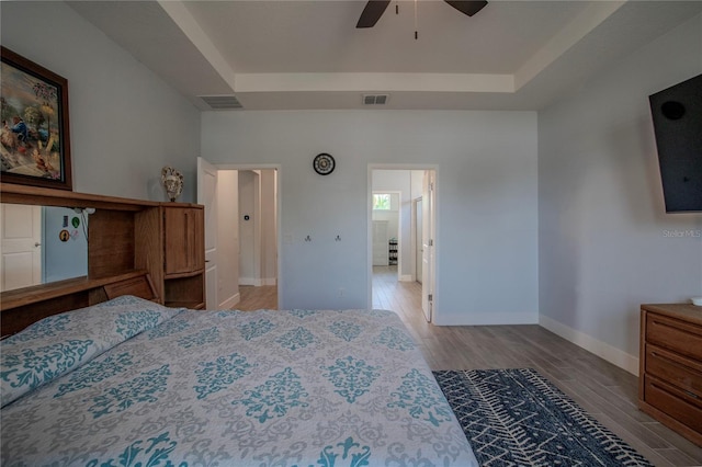 2720 Bancroft Blvd, Orlando, FL 32833 - bedroom featuring baseboards, visible vents, wood finished floors, and a raised ceiling