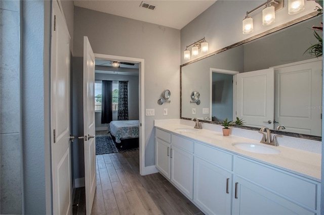 2720 Bancroft Blvd, Orlando, FL 32833 - full bathroom with wood finished floors, a sink, double vanity, and visible vents