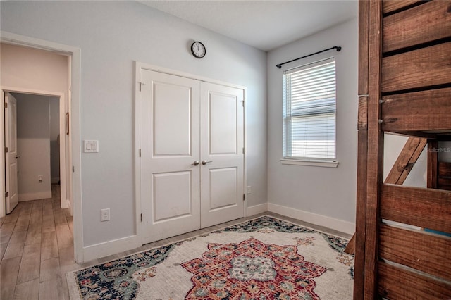 2720 Bancroft Blvd, Orlando, FL 32833 - bedroom featuring baseboards, a closet, and light wood-style flooring