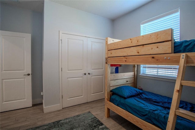 2720 Bancroft Blvd, Orlando, FL 32833 - bedroom with baseboards, a closet, and wood finished floors