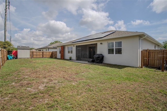 2720 Bancroft Blvd, Orlando, FL 32833 - rear view of property with stucco siding, a fenced backyard, an outdoor structure, and a yard