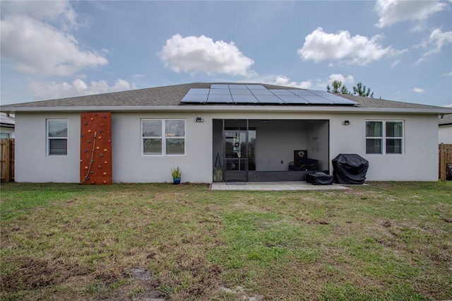 2720 Bancroft Blvd, Orlando, FL 32833 - rear view of house with stucco siding, a sunroom, fence, and a yard