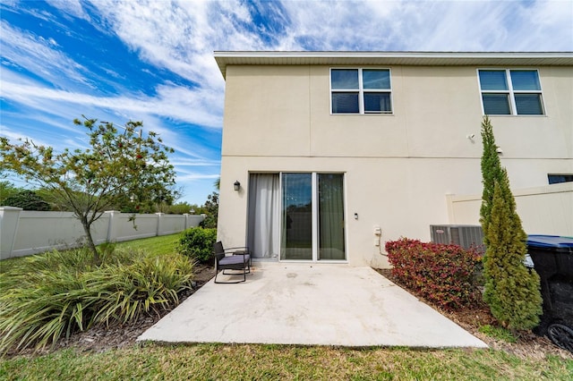 back of property featuring a patio area, a fenced backyard, and stucco siding