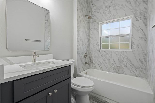 bathroom featuring shower / washtub combination, vanity, and toilet