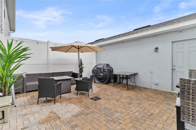 view of patio / terrace featuring outdoor lounge area, fence, and area for grilling