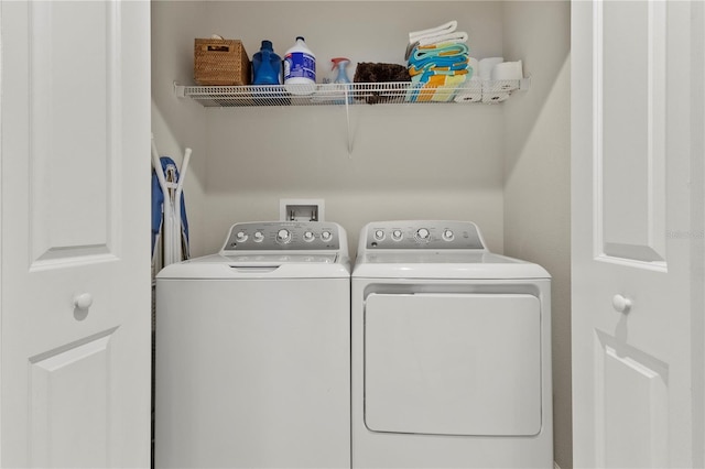 laundry area featuring laundry area and washer and clothes dryer