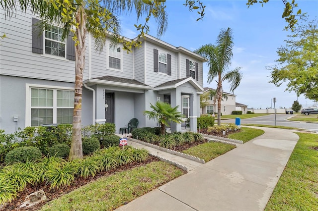 townhome / multi-family property featuring stucco siding