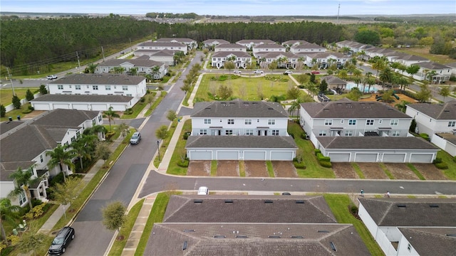 birds eye view of property with a residential view