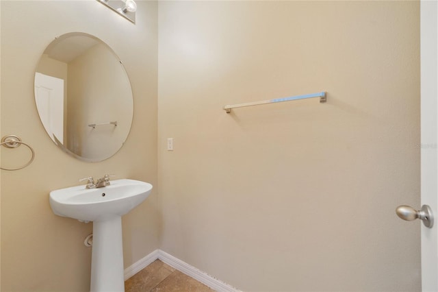 bathroom with tile patterned flooring and baseboards