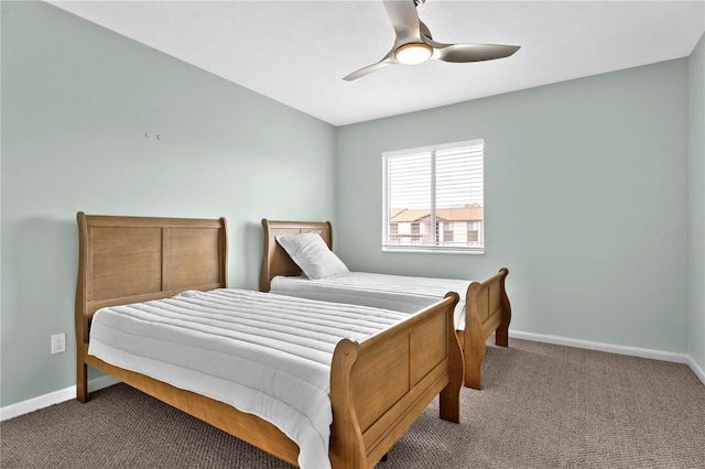 bedroom featuring baseboards, carpet floors, and ceiling fan