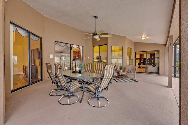 view of patio with ceiling fan and outdoor dining area