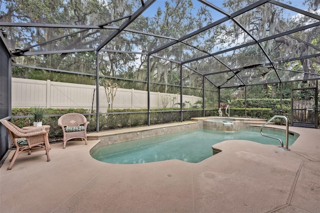 view of pool featuring a pool with connected hot tub, a fenced backyard, a patio, and a lanai