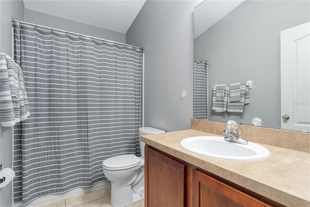 full bathroom with toilet, curtained shower, tile patterned flooring, a textured ceiling, and vanity