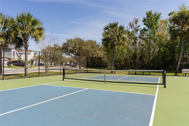 view of sport court with fence