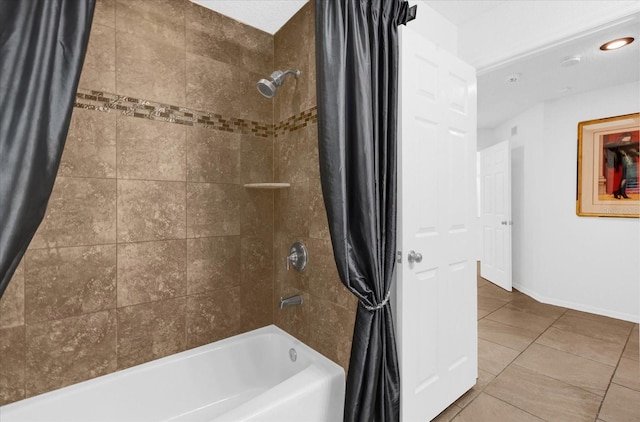 full bath featuring tile patterned flooring, baseboards, and shower / bath combo with shower curtain