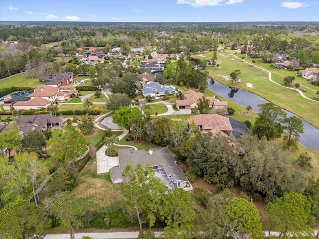 bird's eye view with view of golf course, a water view, and a residential view