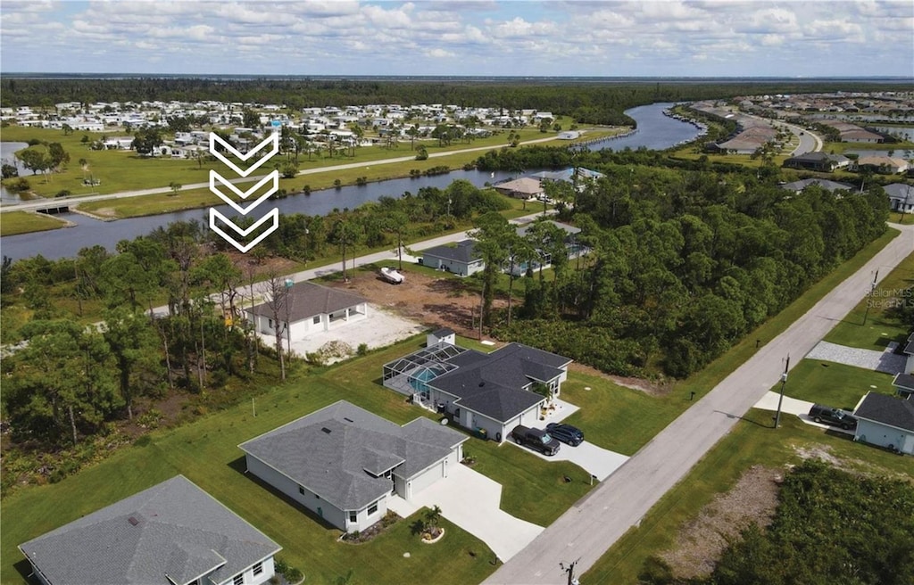 aerial view featuring a residential view and a water view