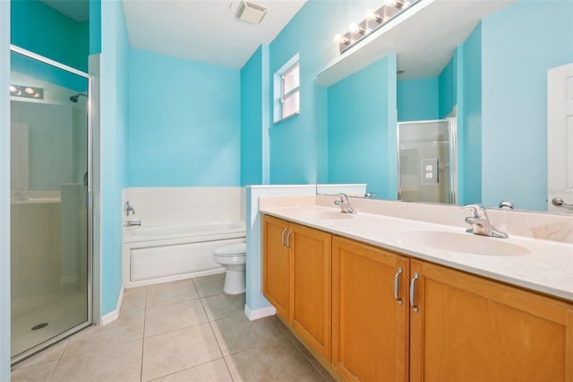 bathroom with tile patterned floors, visible vents, a stall shower, and a sink