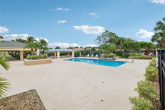 pool with a gazebo, a patio area, and fence