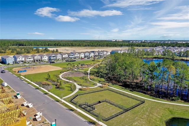 drone / aerial view featuring a water view and a residential view