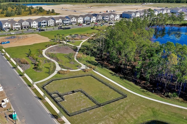 birds eye view of property featuring a water view and a residential view