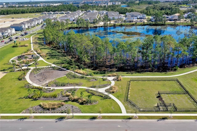 drone / aerial view with a residential view and a water view