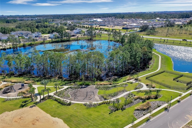 birds eye view of property with a residential view and a water view