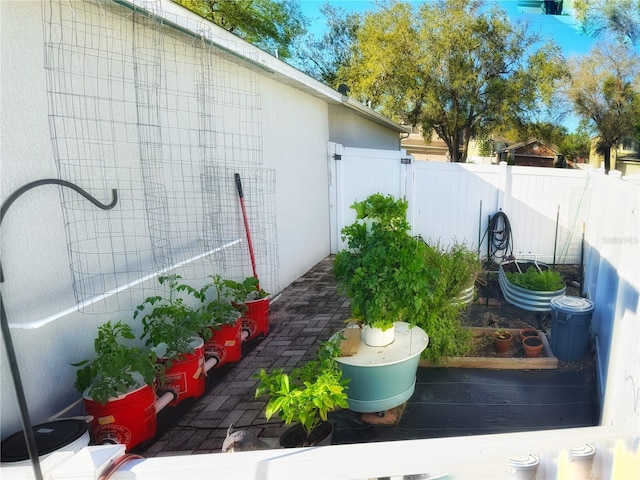 view of yard with a vegetable garden and fence