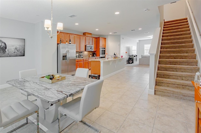 dining area with recessed lighting, visible vents, an inviting chandelier, baseboards, and stairs