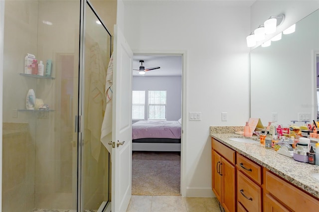 full bath featuring double vanity, ensuite bath, tile patterned flooring, a shower stall, and a sink