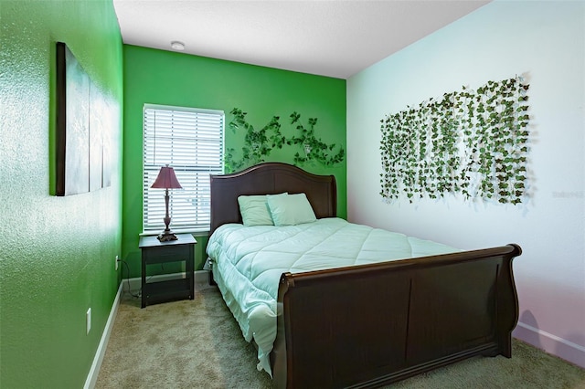 bedroom with carpet flooring and baseboards