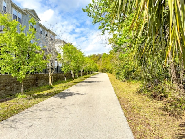 view of community with fence