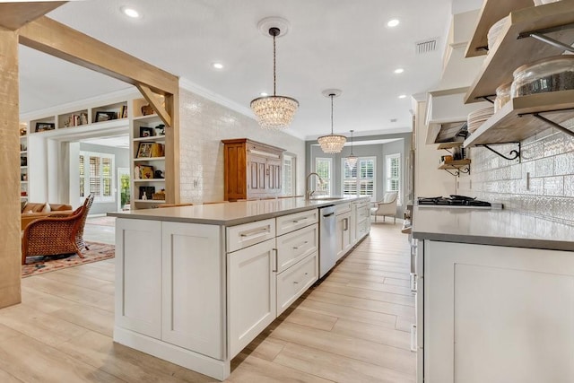 kitchen featuring visible vents, light wood-style flooring, open shelves, white cabinetry, and dishwasher