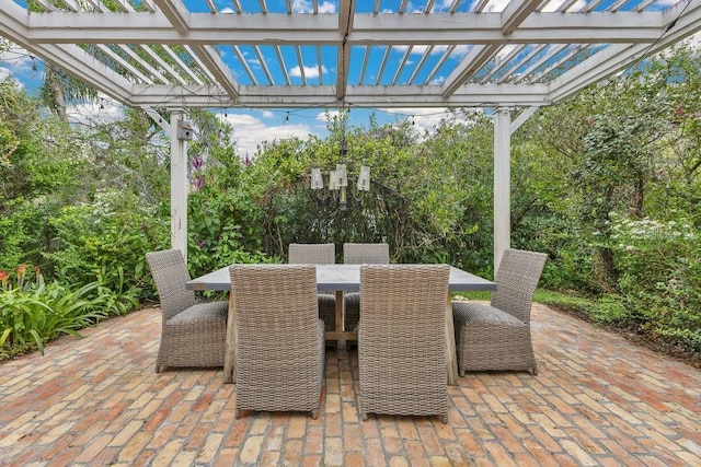 view of patio / terrace with outdoor dining area and a pergola