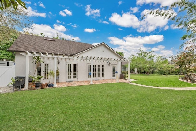 back of house with french doors, a yard, roof with shingles, and fence