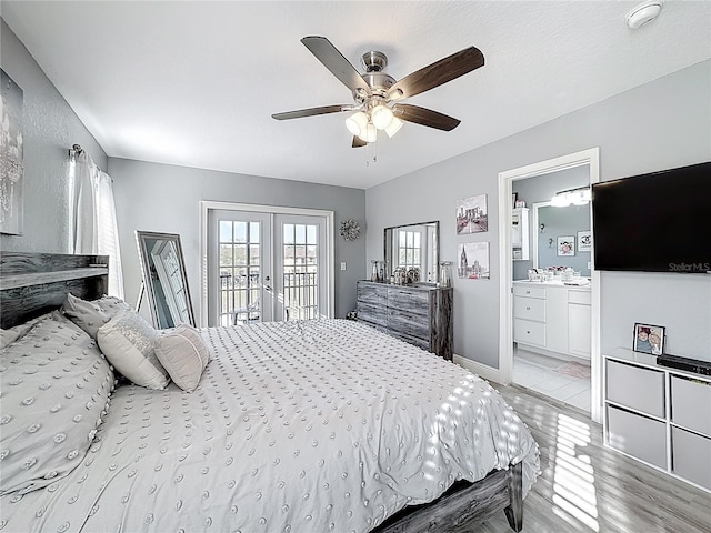 bedroom with access to exterior, french doors, ceiling fan, ensuite bath, and baseboards