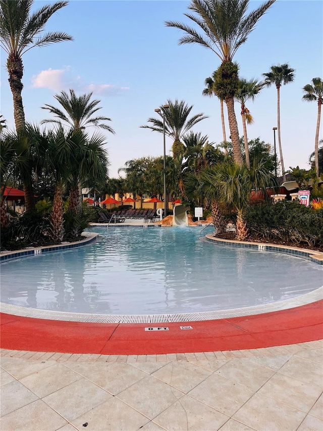 community pool with a water slide