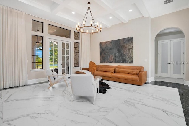 living room with baseboards, french doors, marble finish floor, and arched walkways