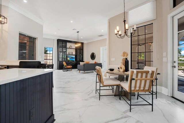 dining space featuring recessed lighting, marble finish floor, a chandelier, and ornamental molding