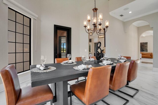 dining area with visible vents, marble finish floor, recessed lighting, arched walkways, and crown molding